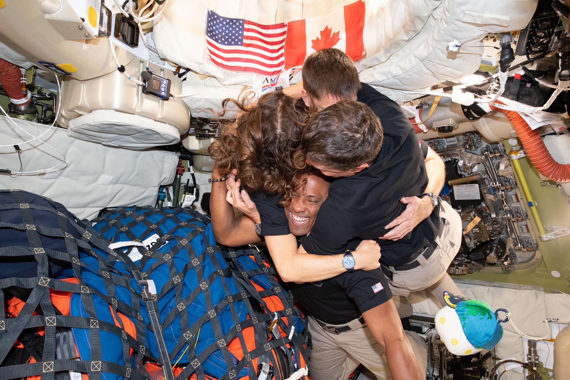 Artemis II crew group hug